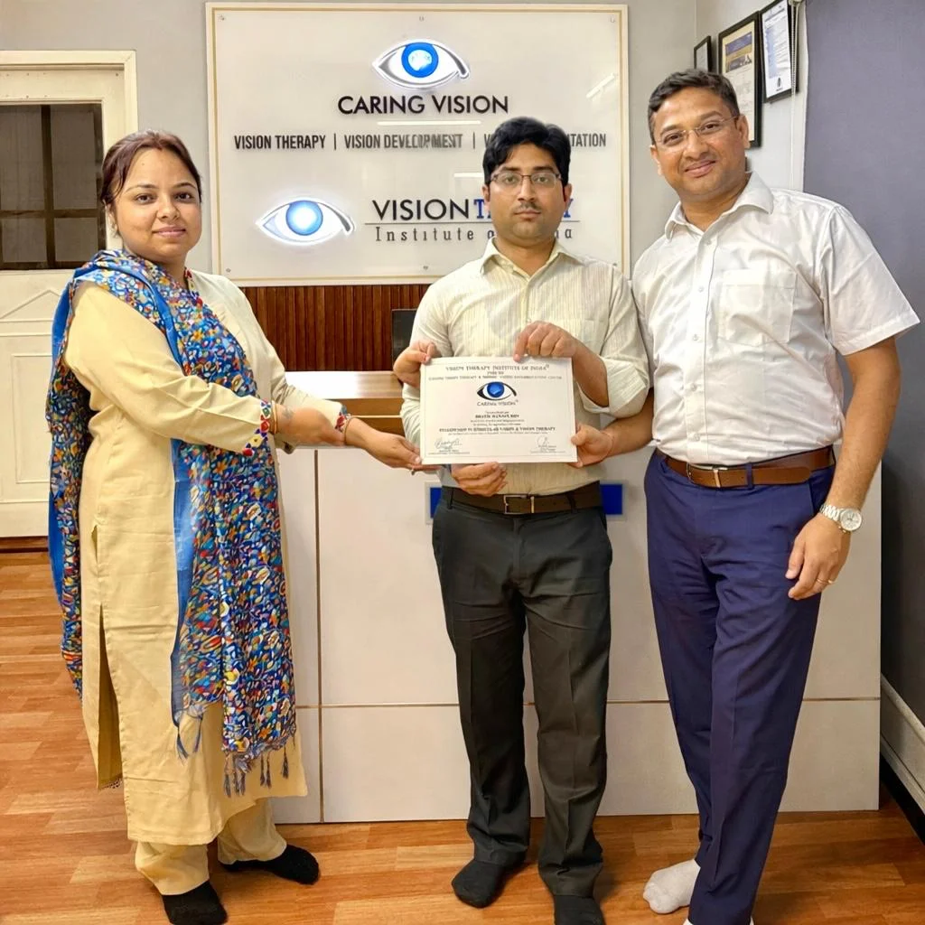 Optom. Bratin Roy receiving Fellowship certificate at Caring Vision branded backdrop